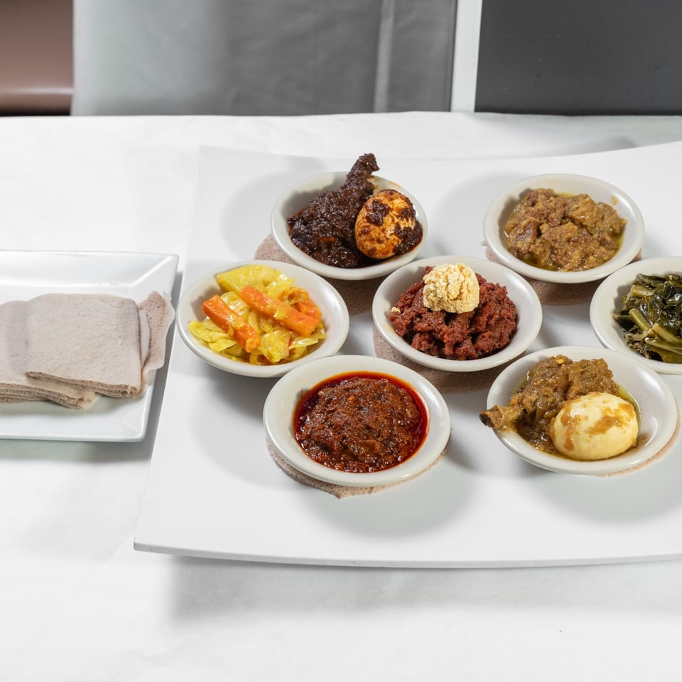 Vegetarian platter with injera and Ethiopian vegetables.