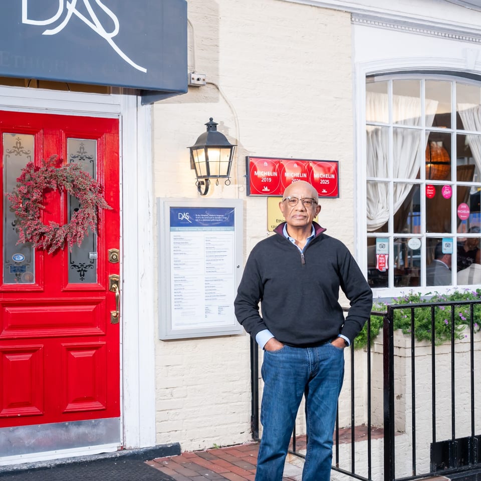 Restaurant owner outside Das Ethiopian Cuisine.