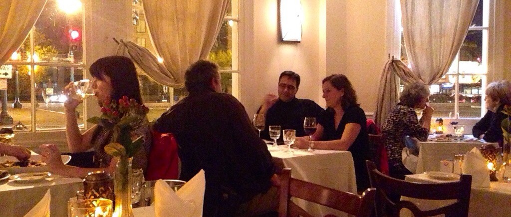 A group of people are dining at a restaurant.