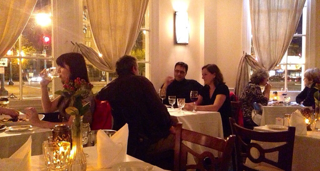 A group of people are dining at a restaurant.