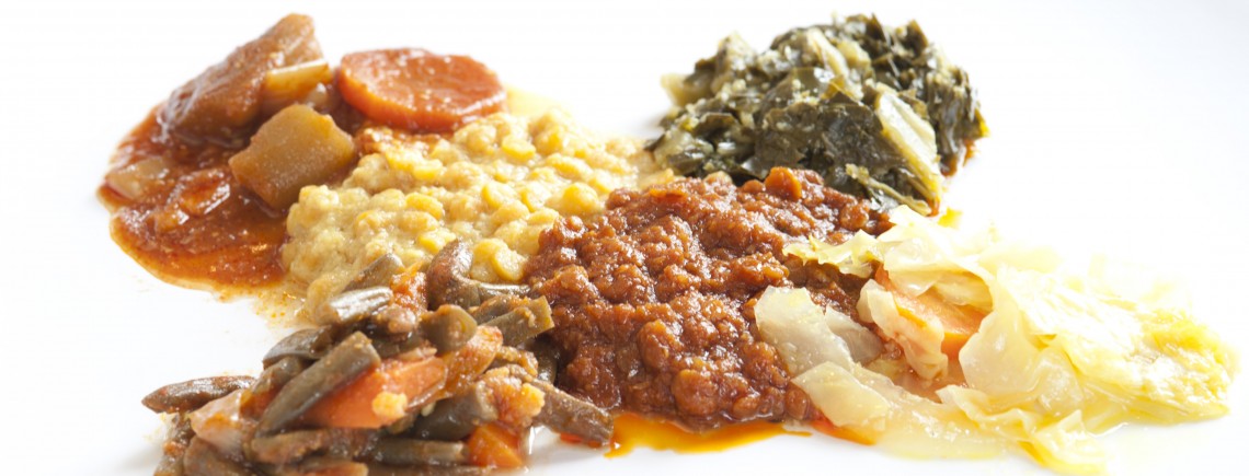 A plate of Ethiopian food with various stews.