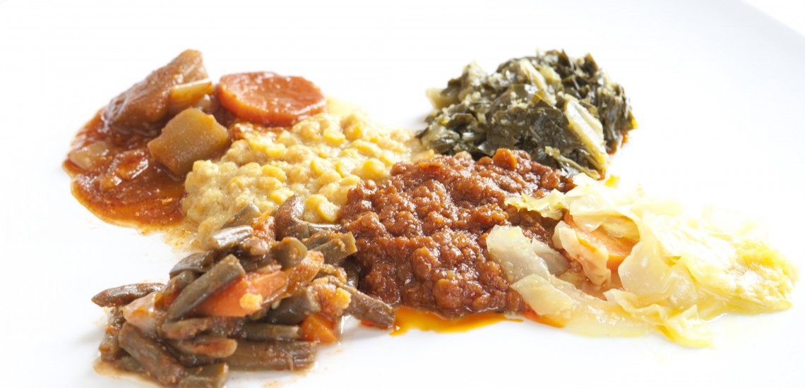 A plate of Ethiopian food with various stews.