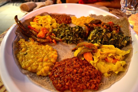 A traditional Ethiopian food platter with various stews.