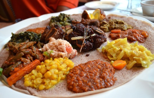 A large Ethiopian platter with various stews.