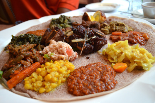 A large Ethiopian platter with various stews.