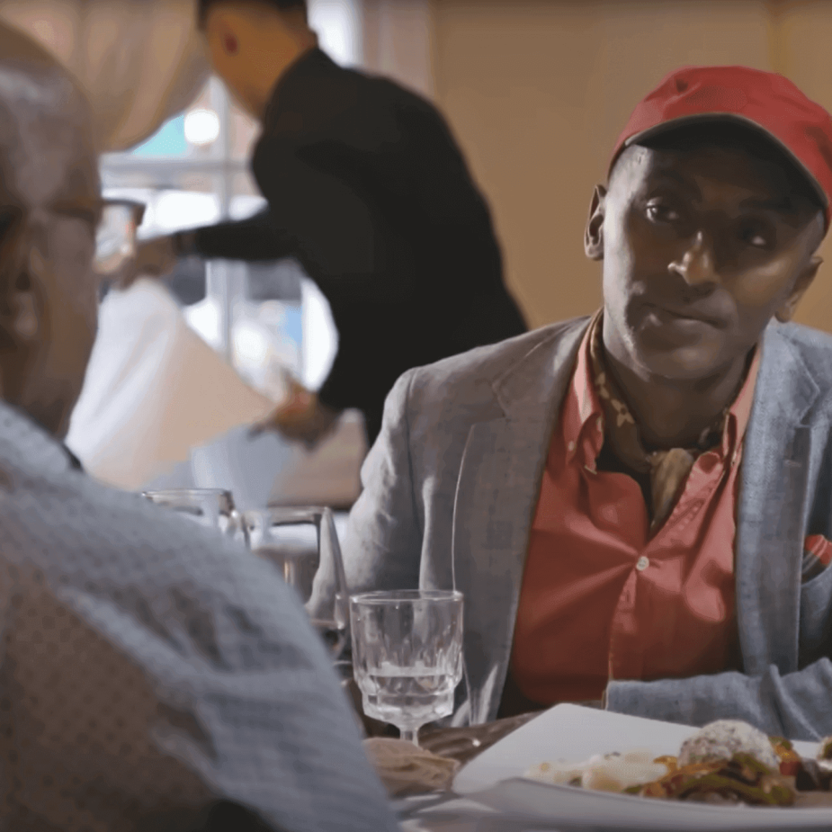 Three people dining in a restaurant setting.